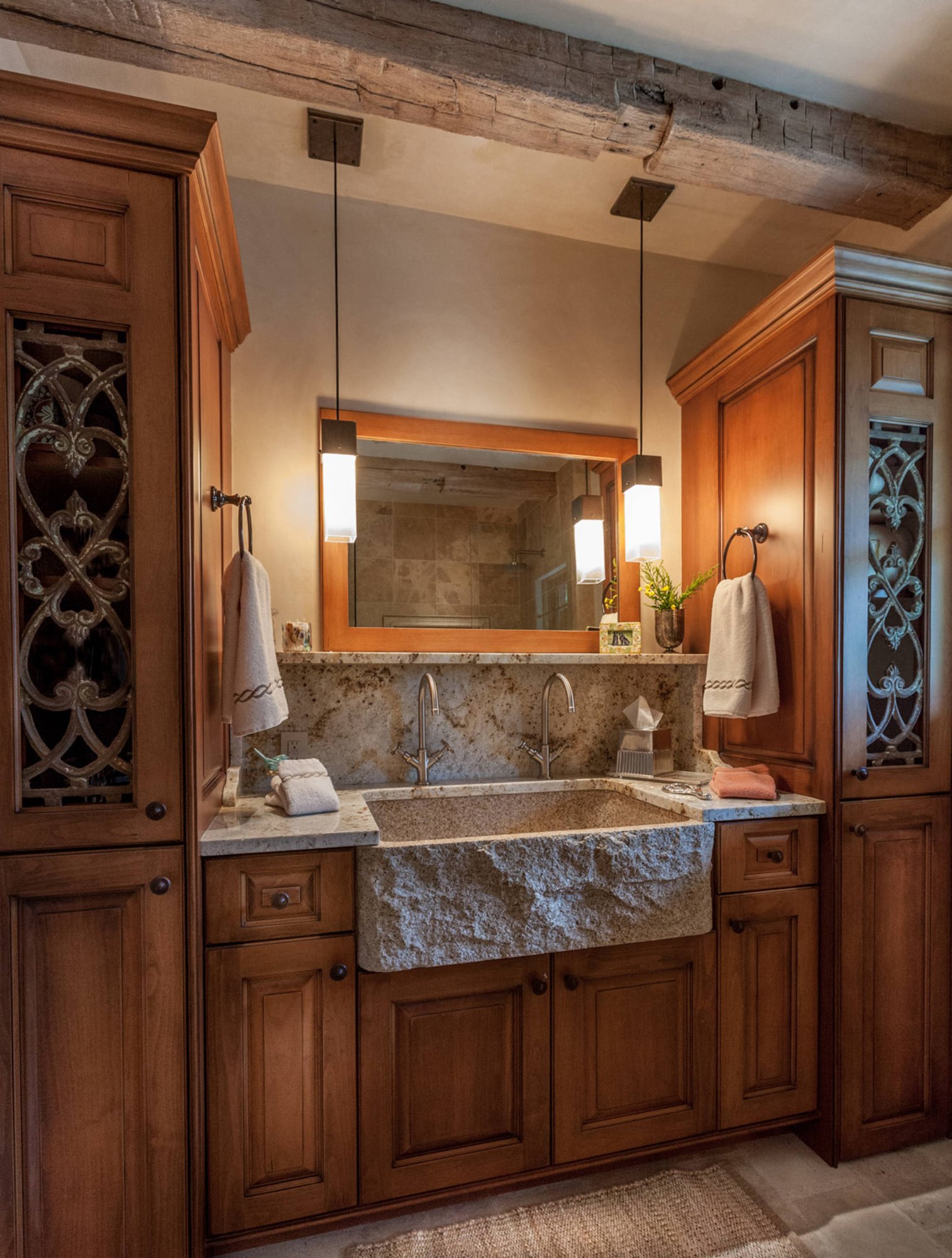Mid-sized arts and crafts master beige tile slate floor bathroom with raised-panel cabinets, medium tone wood cabinets, beige walls, a one-piece toilet, an integrated sink and granite countertops, by Jensen Design in Telluride, CO