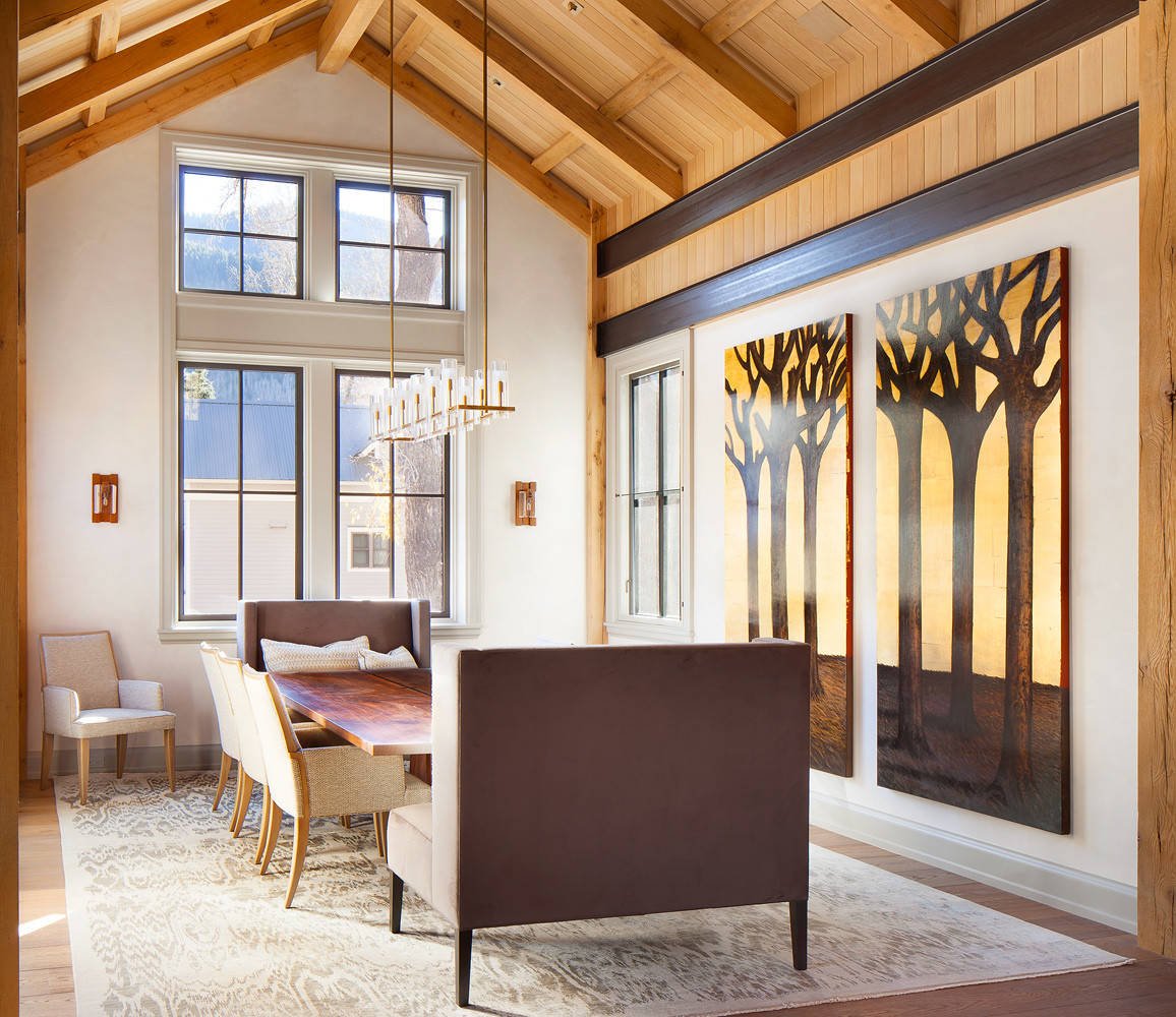 Mountain style dark wood floor kitchen/dining room combo with white walls, by Jensen Design in Telluride, CO