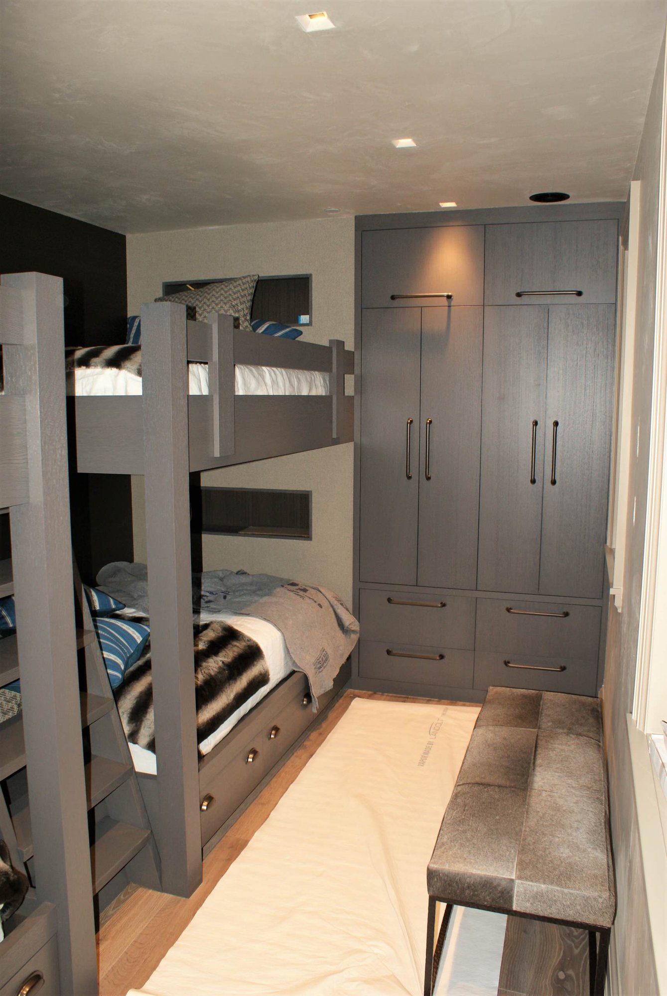 Mid-sized modern guest light wood floor bedroom with no fireplace and gray walls, by Jensen Design in Telluride, CO