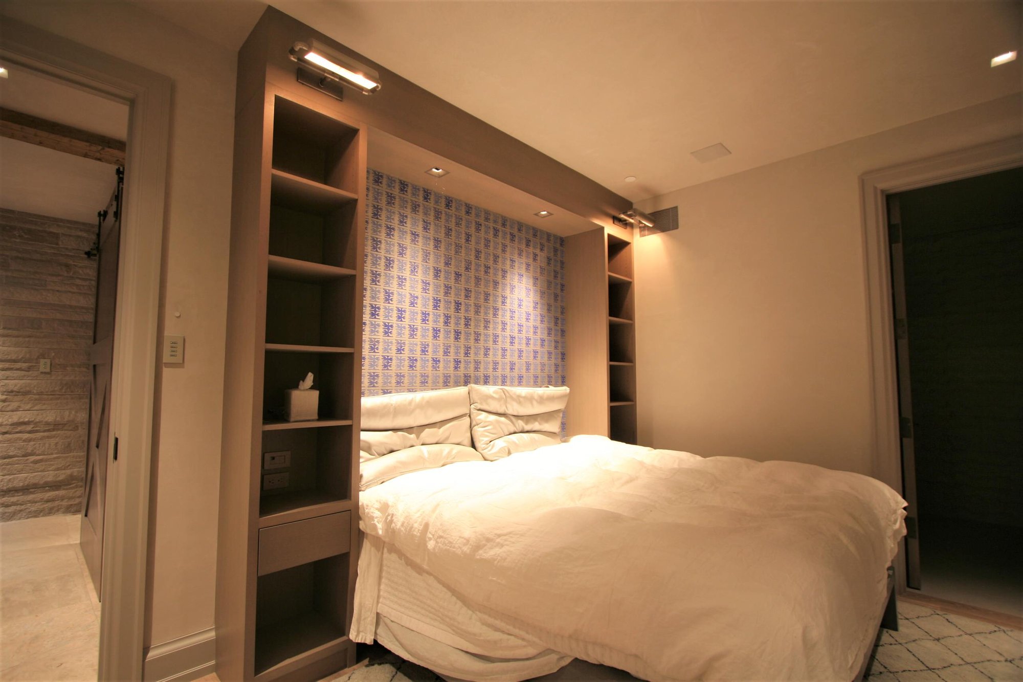 Mid-sized minimalist master light wood floor bedroom with no fireplace and beige walls, by Jensen Design in Telluride, CO