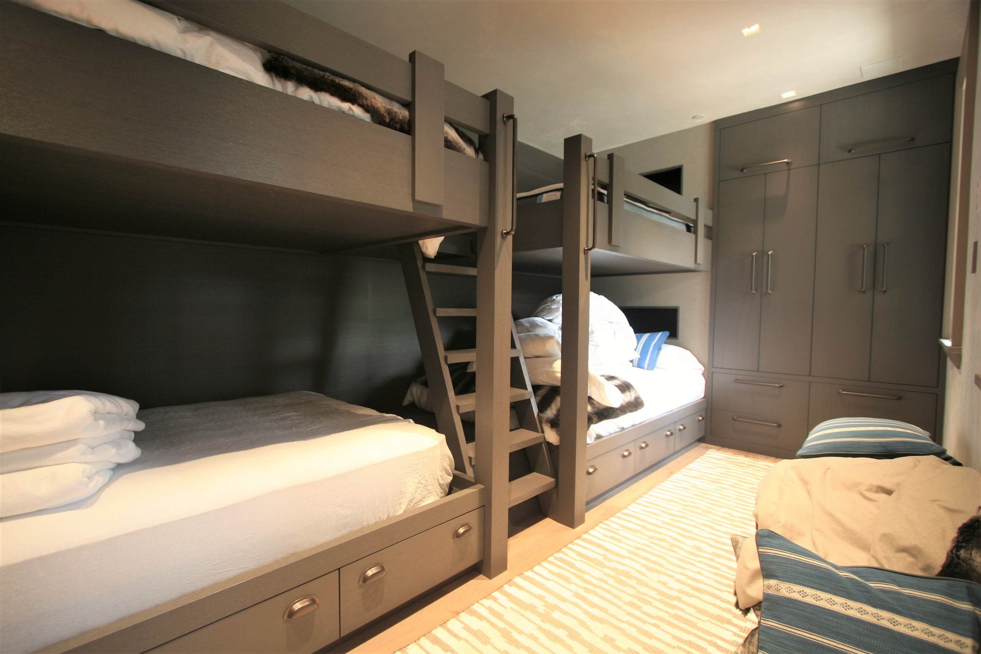 Mid-sized minimalist guest light wood floor bedroom with no fireplace and gray walls, by Jensen Design in Telluride, CO
