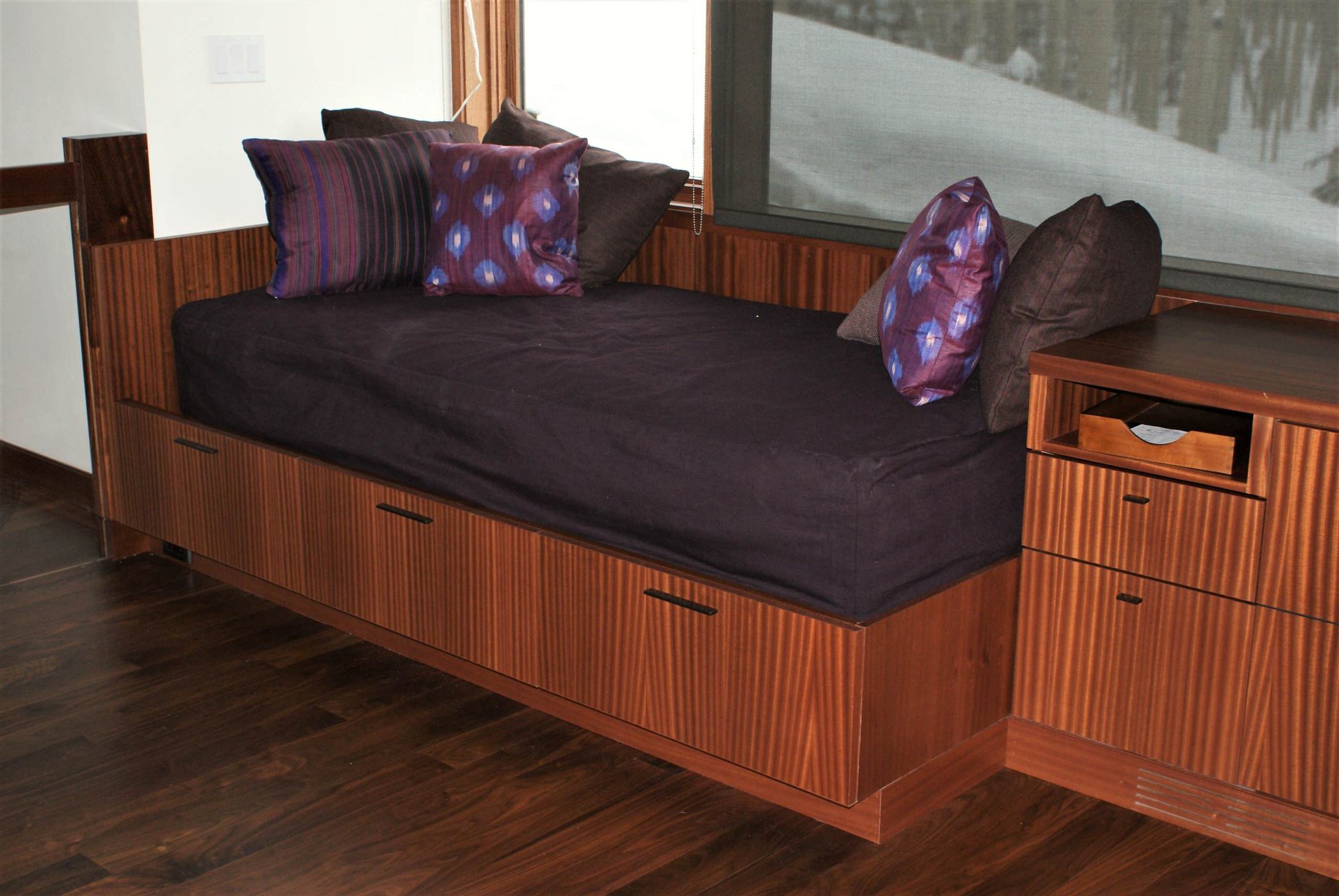 Large contemporary built-in desk dark wood floor study room with white walls, by Jensen Design in Telluride, CO