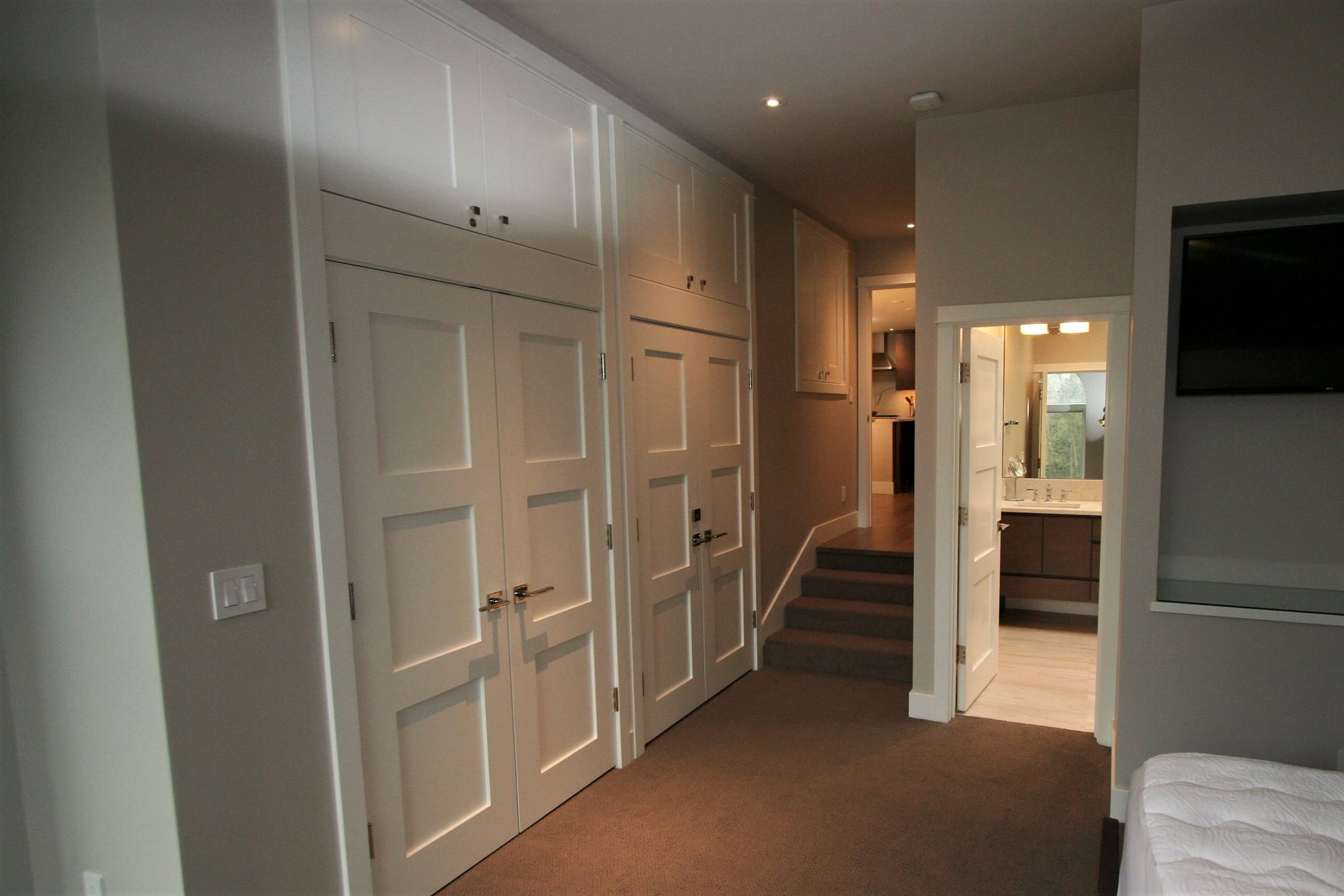 Mid-sized trendy master carpeted and brown floor bedroom with gray walls, by Jensen Design in Telluride, CO
