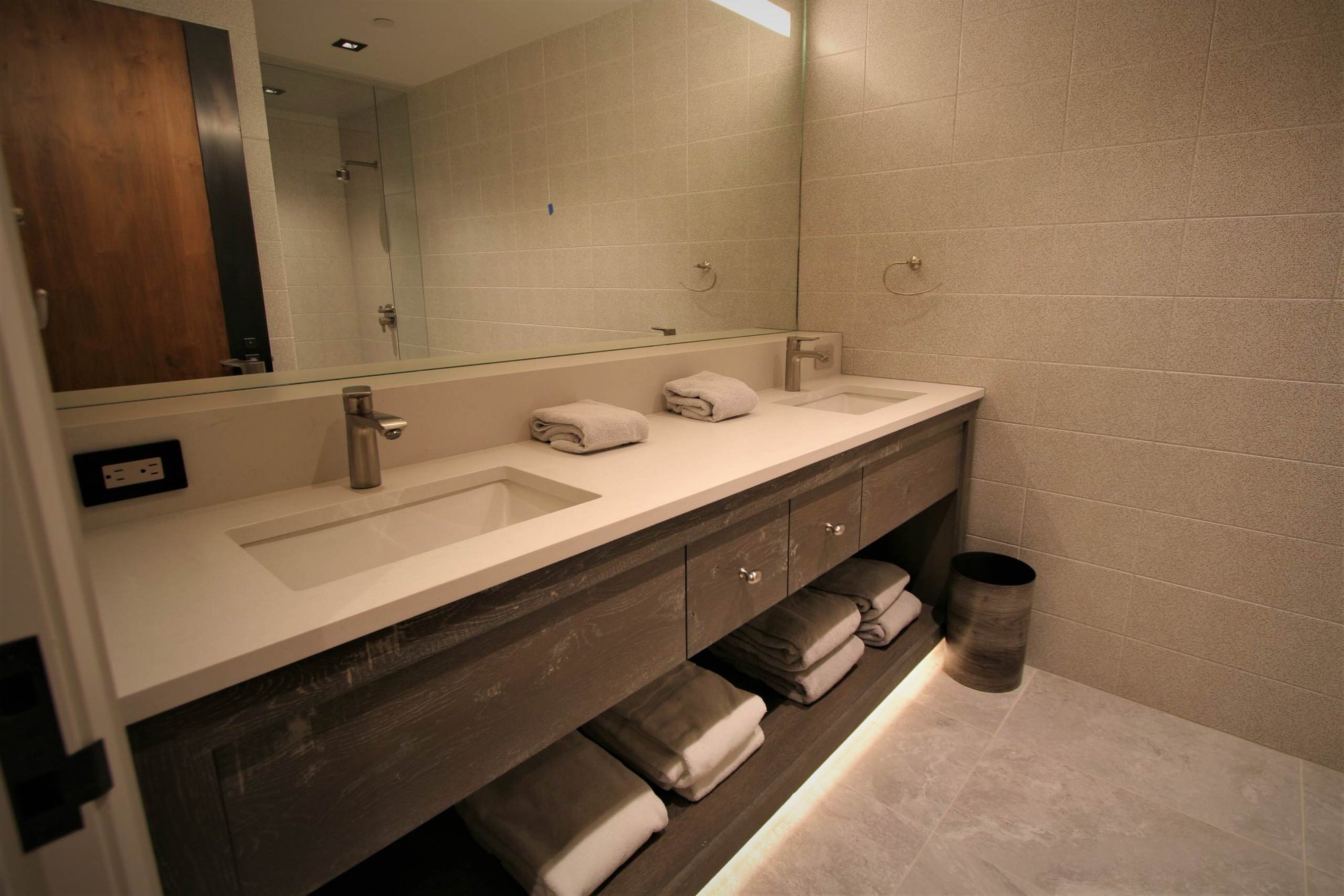 Mid-sized contemporary master gray tile ceramic tile and gray floor bathroom with flat-panel cabinets, gray cabinets, an undermount sink, concrete countertops and a hinged shower door, by Jensen Design in Mountain Village, CO