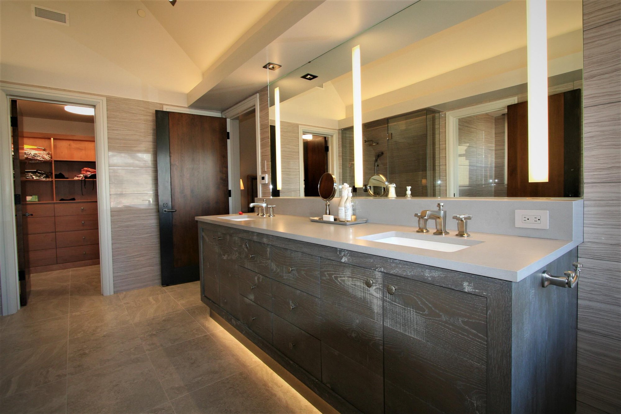 Large contemporary master beige tile and porcelain tile ceramic tile and beige floor walk-in shower with flat-panel cabinets, gray cabinets, an undermount tub, an undermount sink, concrete countertops, a hinged shower door and beige walls, by Jensen Design in Mountain Village, CO