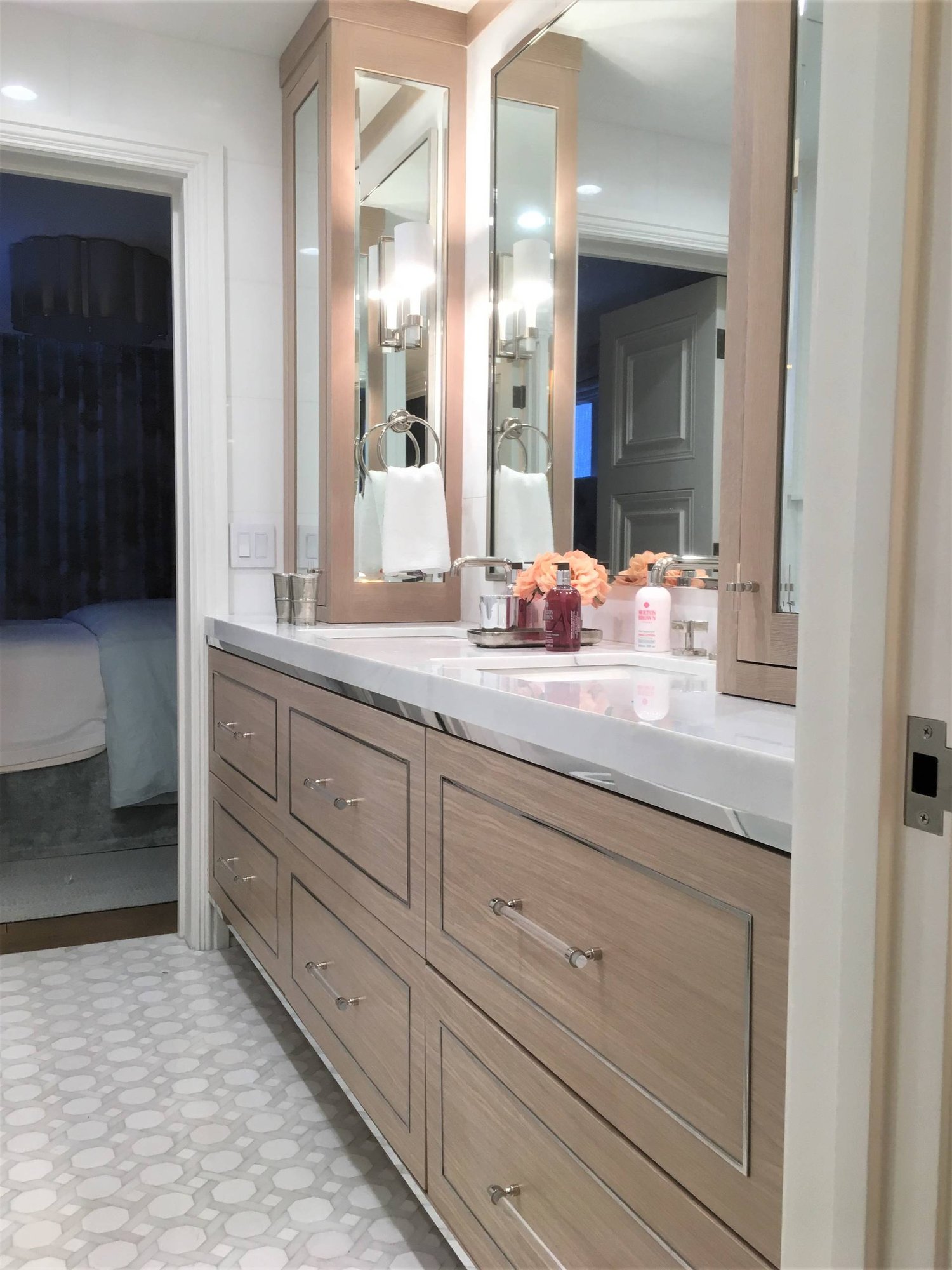 Mid-sized minimalist master mosaic tile floor and white floor bathroom with flat-panel cabinets, light wood cabinets, white walls, an undermount sink, marble countertops and a hinged shower door, by Jensen Design in Telluride, CO