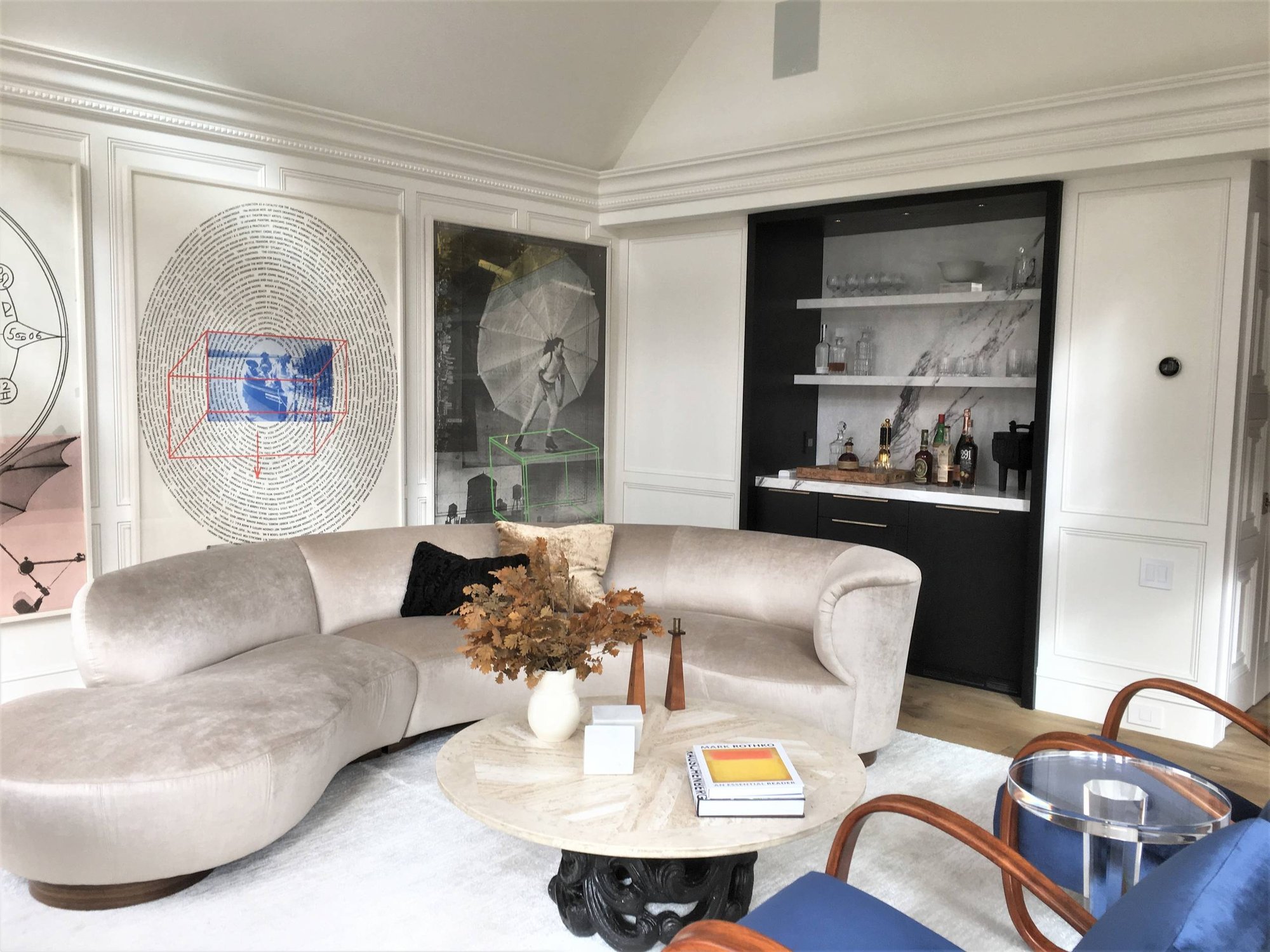 Mid-sized modern galley light wood floor home bar with no sink, flat-panel cabinets, black cabinets, marble countertops, white backsplash and marble backsplash, by Jensen Design in Telluride, CO