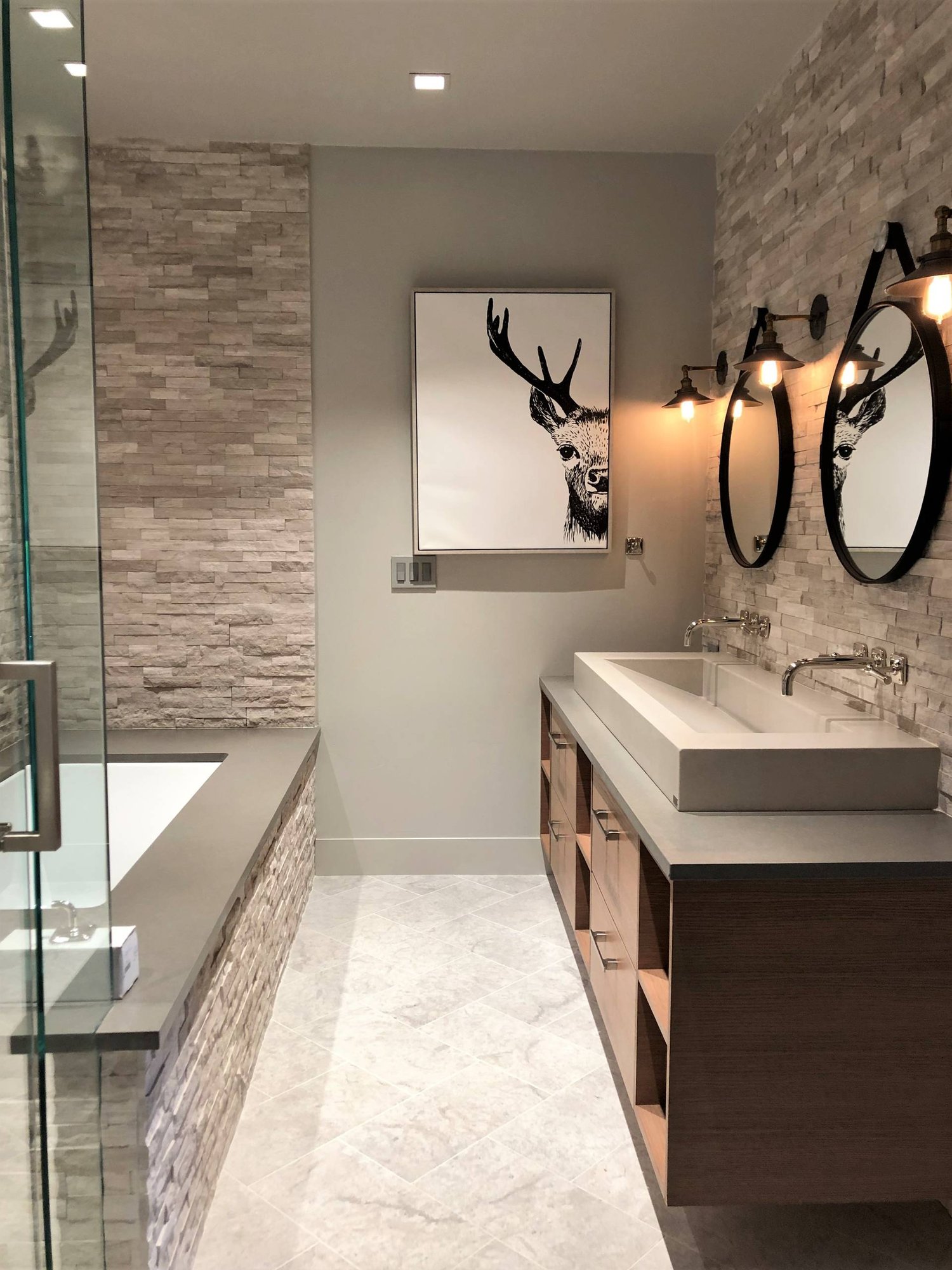 Mid-sized contemporary gray tile and stone tile gray floor and marble floor bathroom with flat-panel cabinets, medium tone wood cabinets, a two-piece toilet, gray walls, a vessel sink, quartzite countertops, a hinged shower door and gray countertops, by Jensen Design in Mountain Village, CO