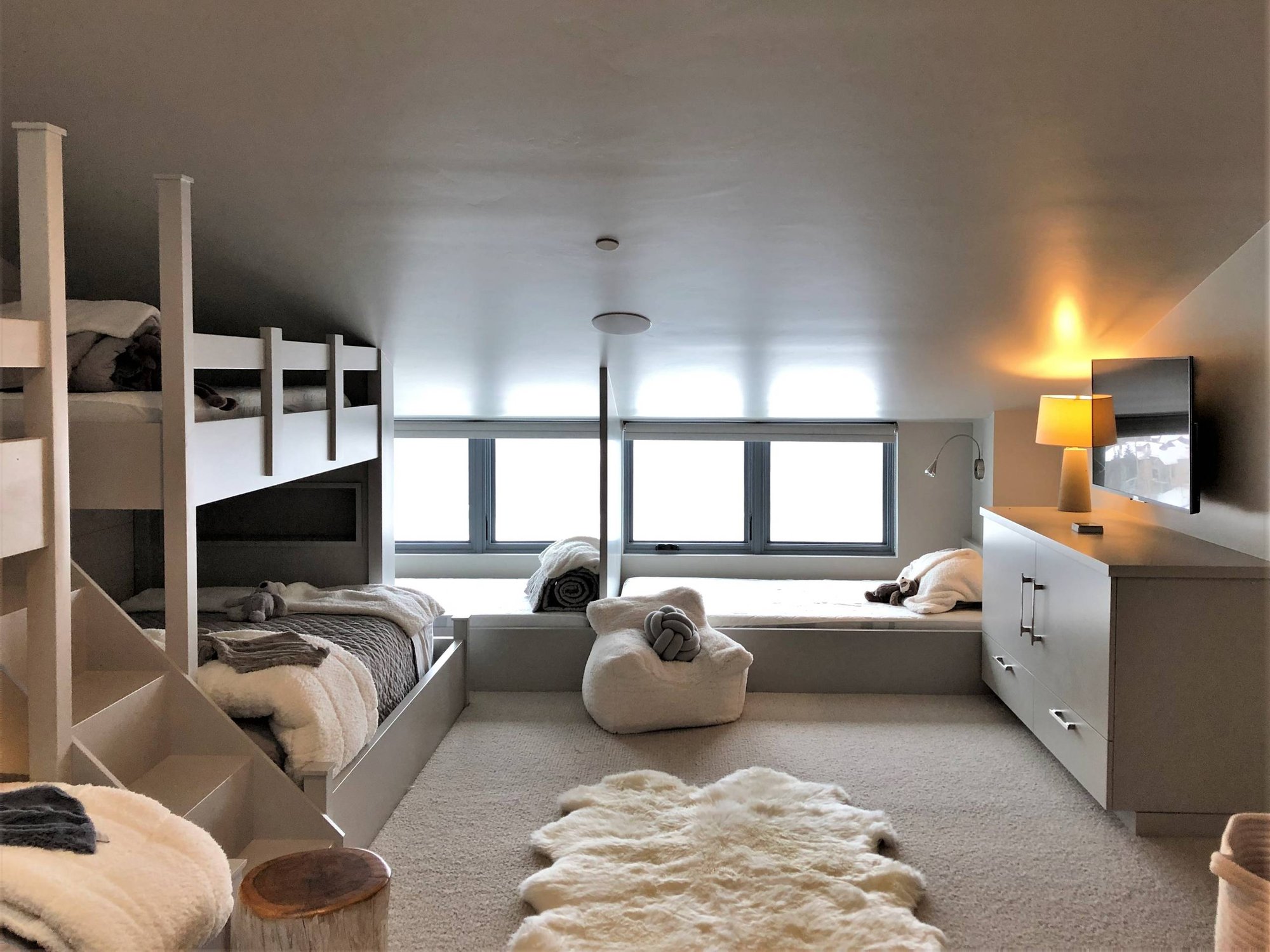 Mid-sized trendy guest carpeted and gray floor bedroom with gray walls and no fireplace, by Jensen Design in Mountain Village, CO