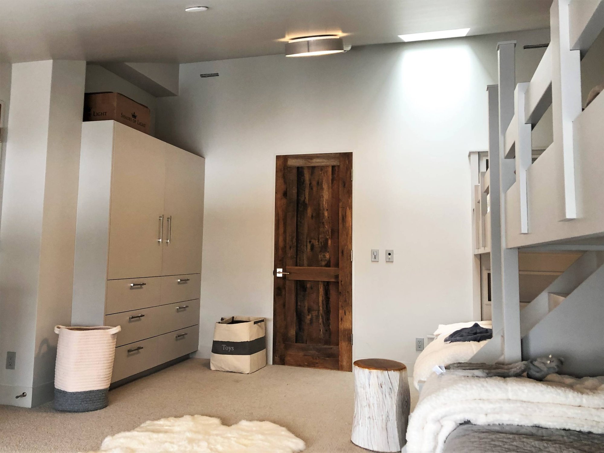 Mid-sized trendy guest carpeted and gray floor bedroom with gray walls and no fireplace, by Jensen Design in Mountain Village, CO
