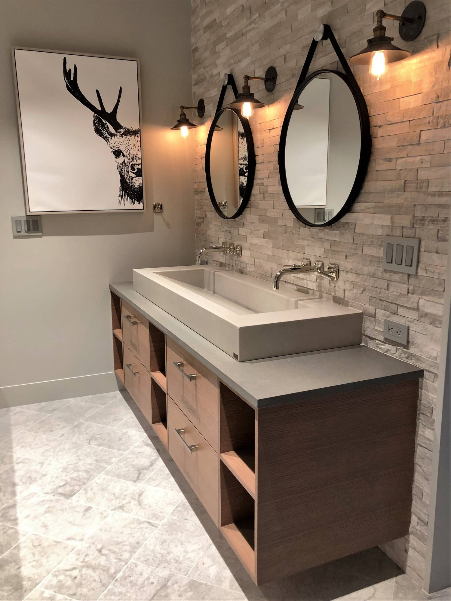 Mid-sized trendy gray tile and stone tile gray floor and marble floor bathroom with flat-panel cabinets, medium tone wood cabinets, a two-piece toilet, gray walls, a vessel sink, quartzite countertops, a hinged shower door and gray countertops, by Jensen Design in Mountain Village, CO