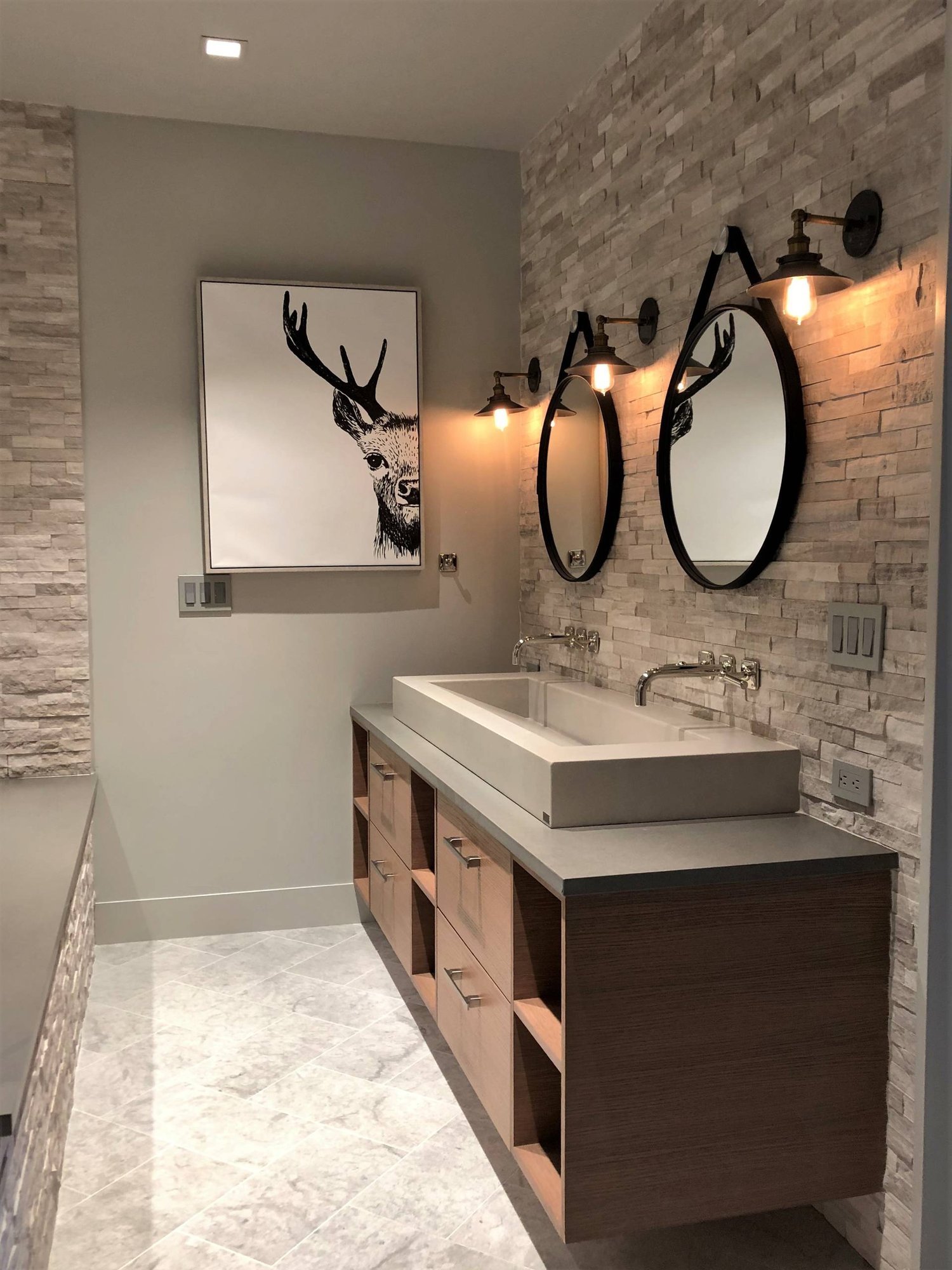 Mid-sized contemporary gray tile and stone tile marble floor and gray floor alcove shower with flat-panel cabinets, medium tone wood cabinets, a two-piece toilet, gray walls, a vessel sink, quartzite countertops and gray countertops, by Jensen Design in Mountain Village, CO