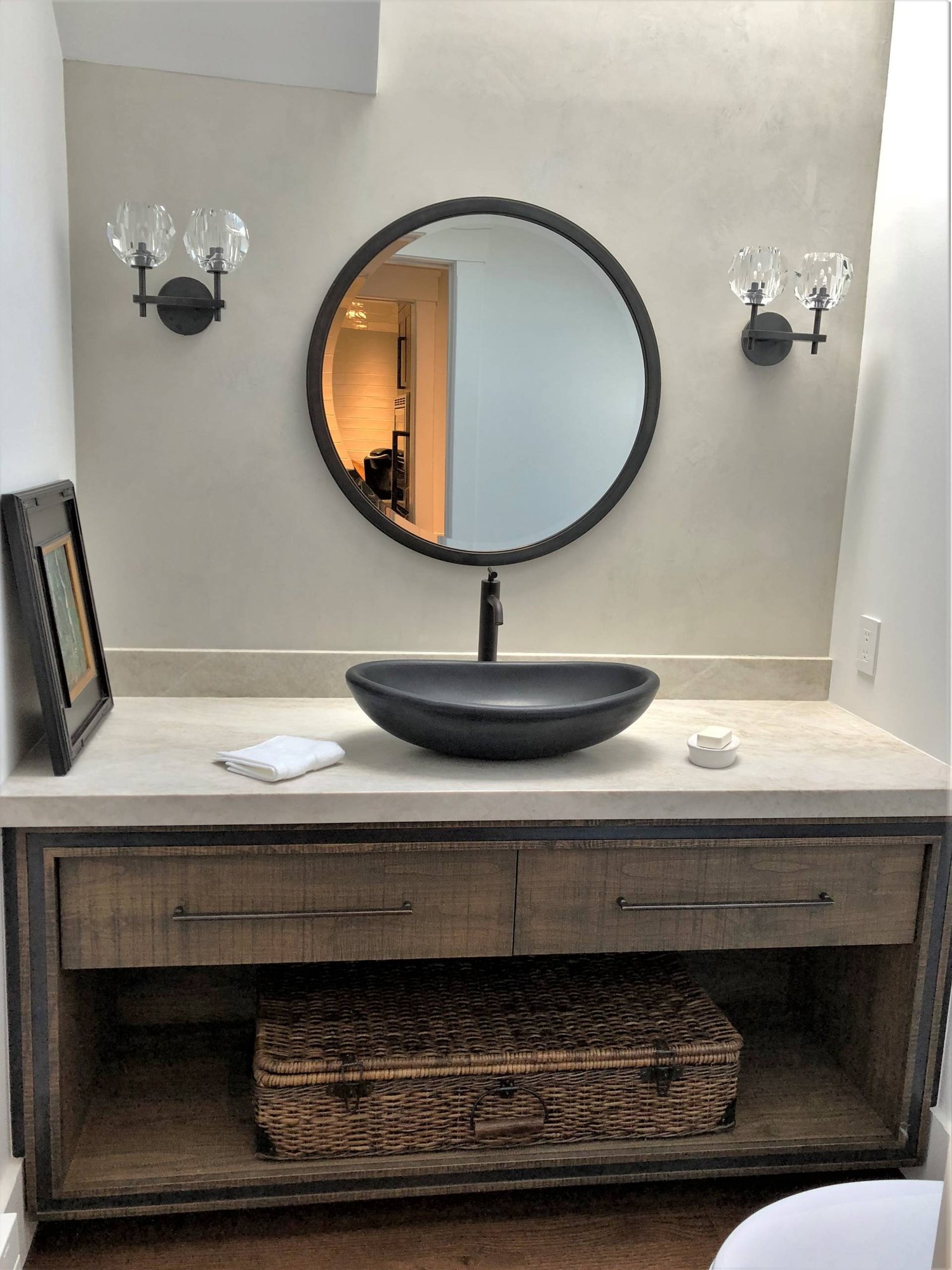 Mid-sized trendy 3/4 stone slab medium tone wood floor and brown floor bathroom with flat-panel cabinets, distressed cabinets, a two-piece toilet, gray walls, a vessel sink, quartzite countertops and white countertops, by Jensen Design in Telluride, CO
