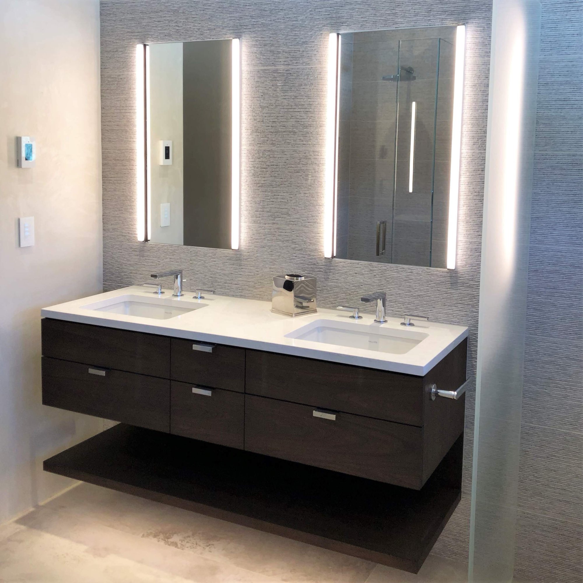 Mid-sized contemporary master gray tile beige floor, double-sink and vaulted ceiling bathroom with flat-panel cabinets, dark wood cabinets, gray walls, an undermount sink, white countertops and a floating vanity, by Jensen Design in Telluride, CO