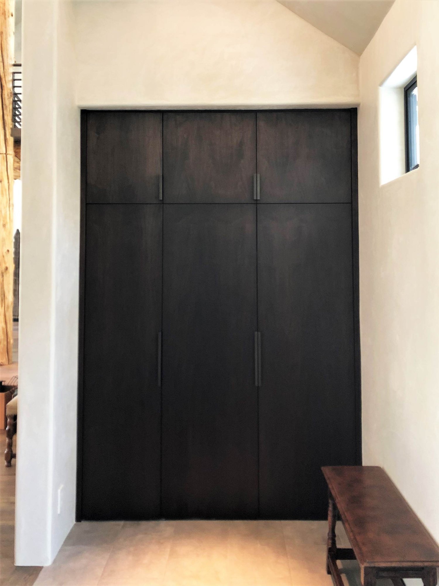 Large contemporary galley medium tone wood floor, brown floor and vaulted ceiling open concept kitchen with an undermount sink, flat-panel cabinets, dark wood cabinets, colored appliances, an island and multicolored countertops, by Jensen Design in Telluride, CO