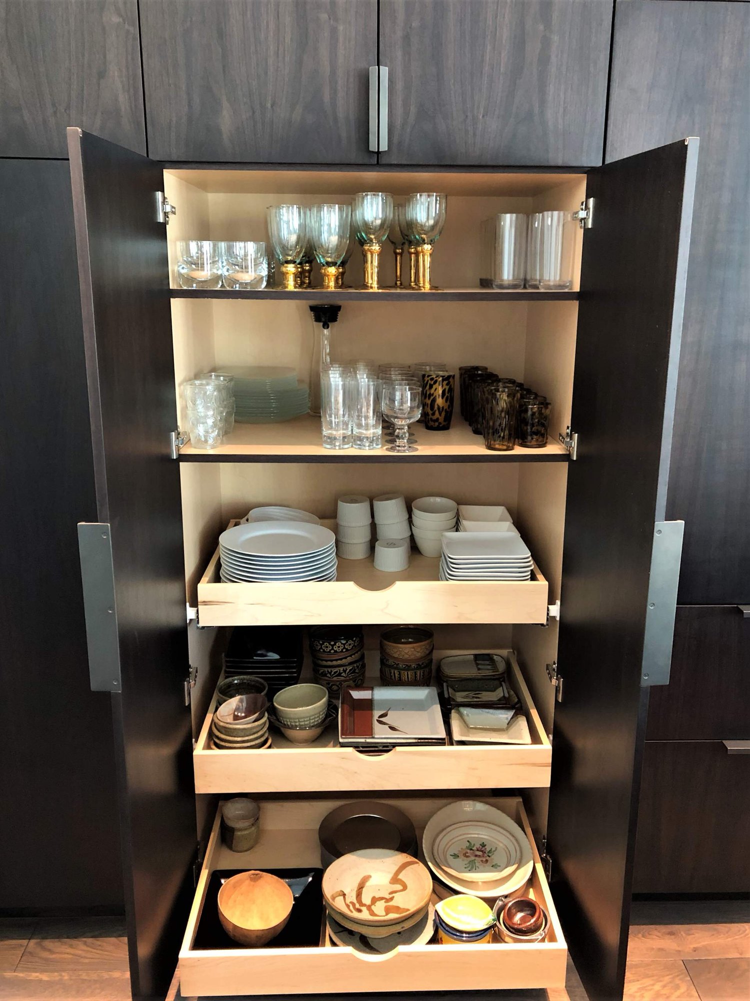 Large contemporary galley medium tone wood floor, brown floor and vaulted ceiling open concept kitchen with an undermount sink, flat-panel cabinets, dark wood cabinets, colored appliances, an island and multicolored countertops, by Jensen Design in Telluride, CO