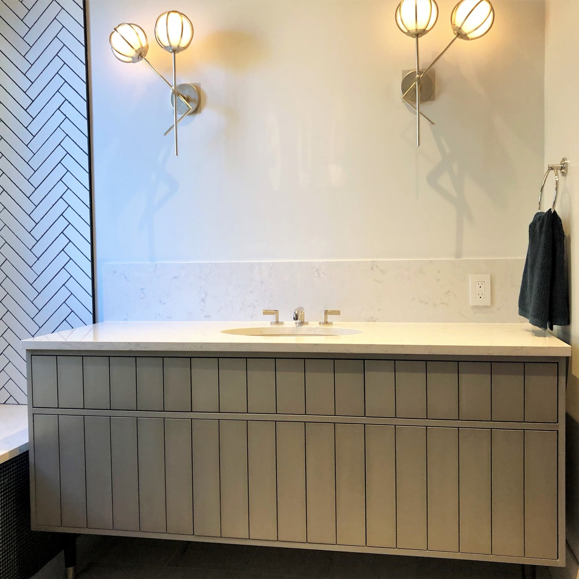 Mid-sized trendy kids' white tile single-sink drop-in bathtub with flat-panel cabinets, gray cabinets, white walls, an undermount sink, beige countertops and a freestanding vanity, by Jensen Design in Telluride, CO