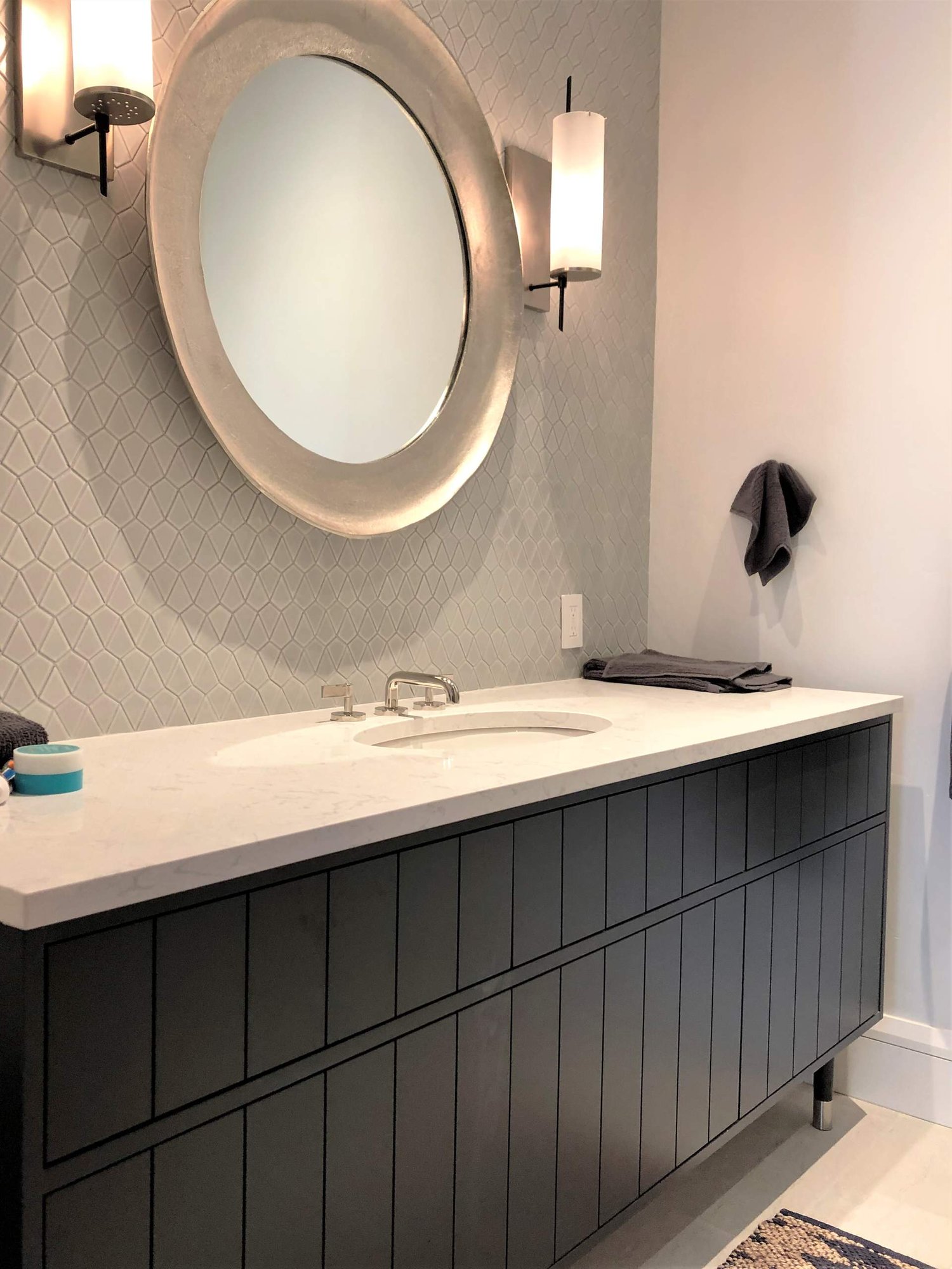 Mid-sized trendy kids' gray tile single-sink drop-in bathtub with flat-panel cabinets, black cabinets, white walls, an undermount sink, beige countertops and a freestanding vanity, by Jensen Design in Telluride, CO