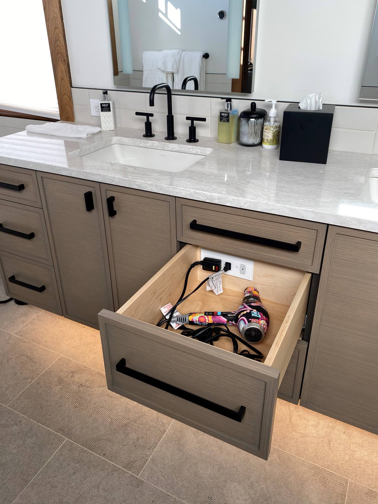 Mid-sized transitional master white tile double-sink bathroom with recessed-panel cabinets, medium tone wood cabinets, white walls, an undermount sink, white countertops and a floating vanity, by Jensen Design in Telluride, CO