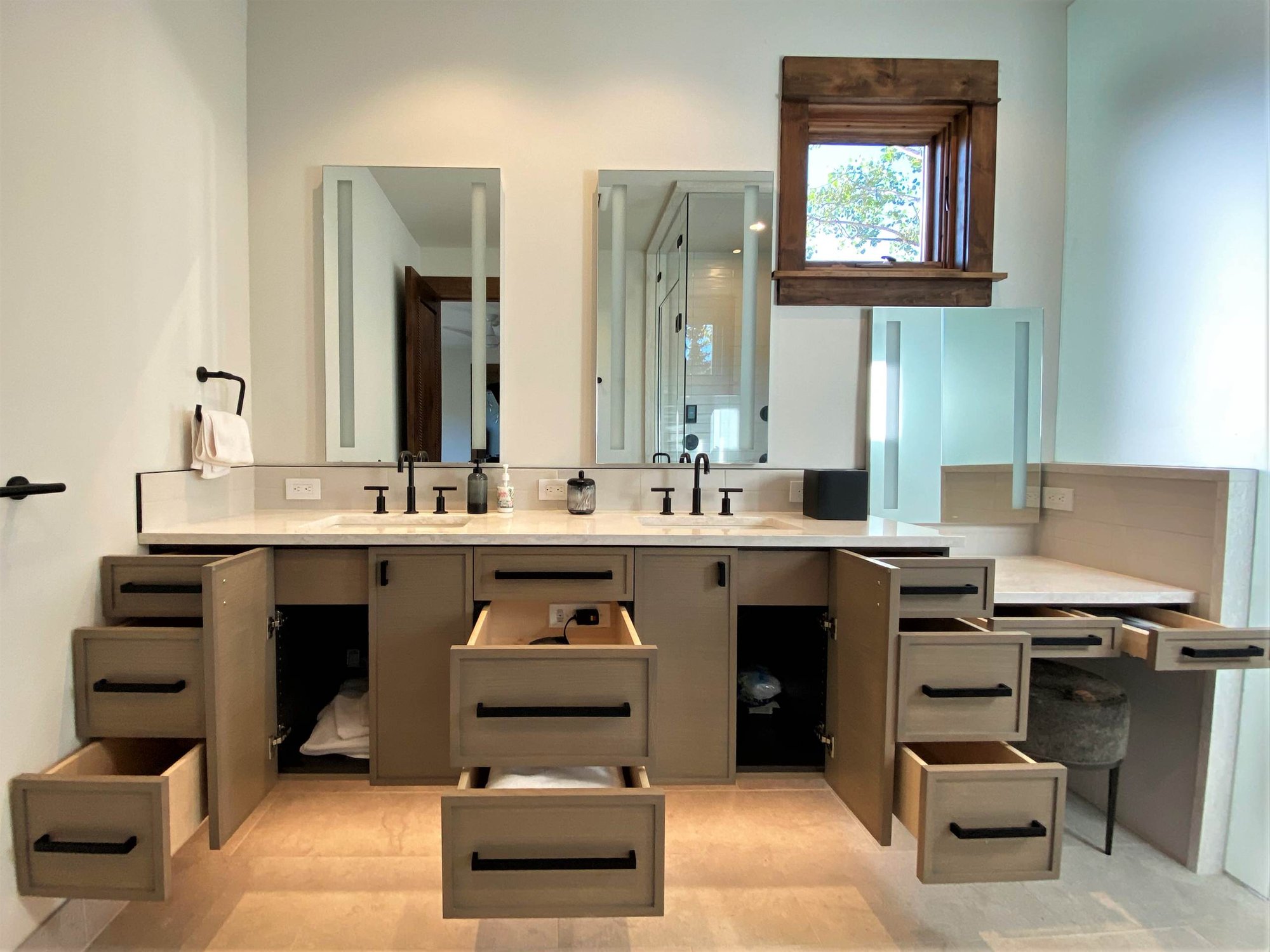 Mid-sized transitional master white tile double-sink bathroom with recessed-panel cabinets, medium tone wood cabinets, white walls, an undermount sink, white countertops and a floating vanity, by Jensen Design in Telluride, CO