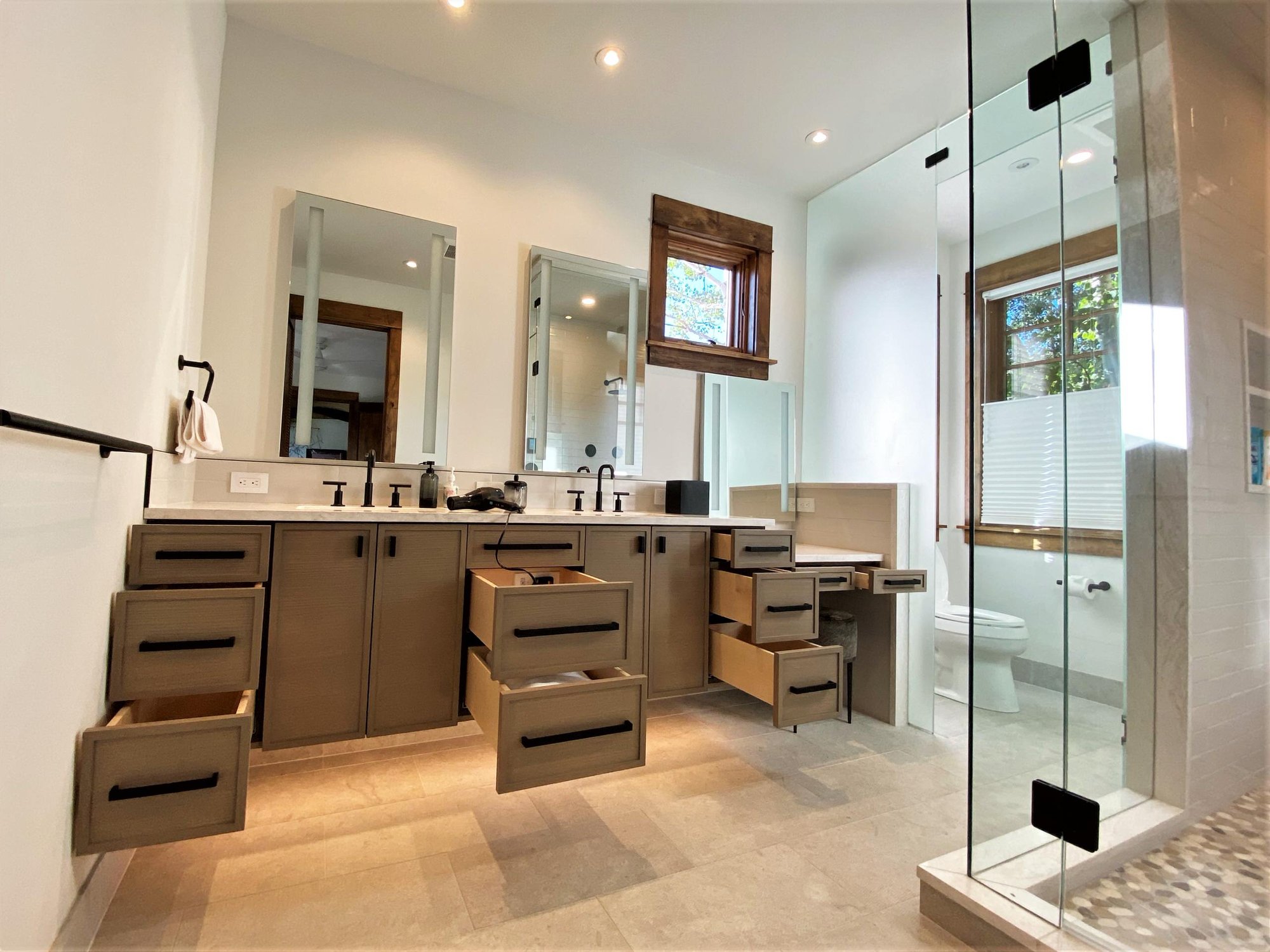 Mid-sized transitional master white tile double-sink bathroom with recessed-panel cabinets, medium tone wood cabinets, white walls, an undermount sink, white countertops and a floating vanity, by Jensen Design in Telluride, CO