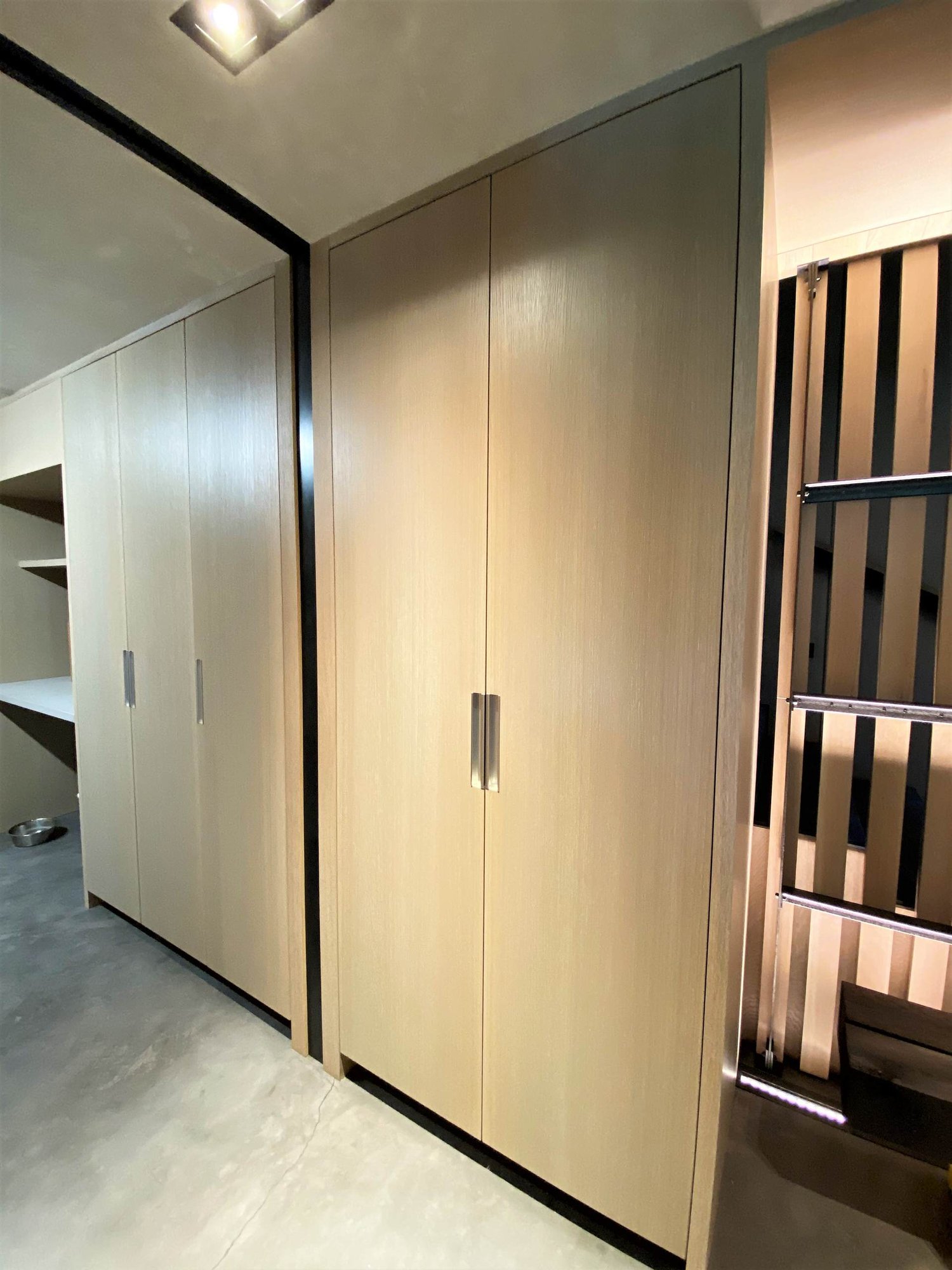 Mid-sized contemporary concrete floor, gray floor and wood wall hallway, by Jensen Design in Telluride, CO